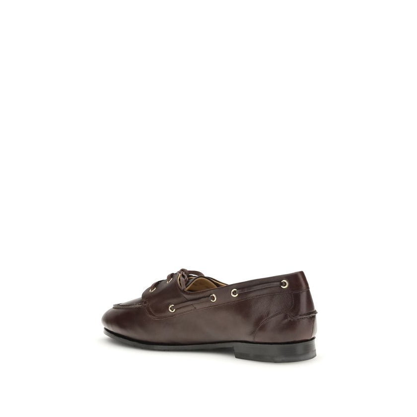 Brown Calf Leather Bos Taurus Slip-On LoafersPathy leather Loafers by Bally feature an almond toe and a boat-inspired design, with a leather ribbon that ties at the front, adding an elegant and refined touch. The leather block heel offers stability and co