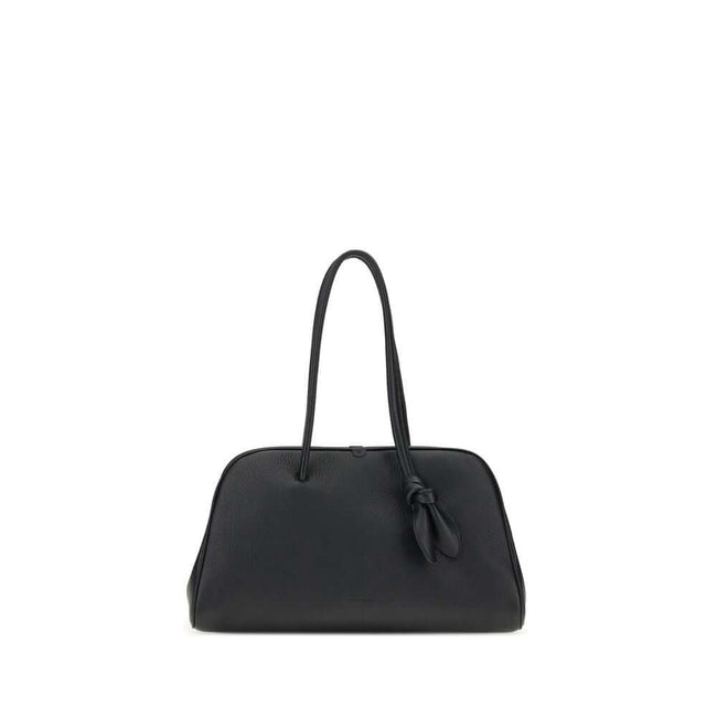 Black Calf Leather Bos Taurus HandbagThe Il Turismo Shoulder Bag by Jacquemus is an elegant reinterpretation of the classic bowling bag, crafted from grainy leather. Featuring a two-way zipper closure, it features a large patch pocket on the front, an int