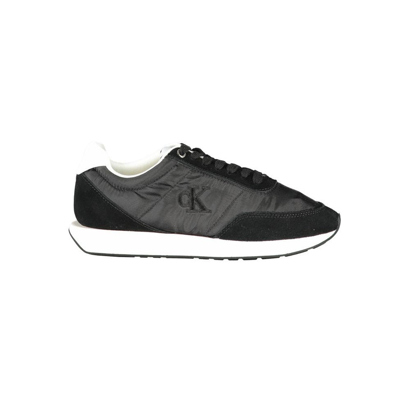 Black Leather Women SneakerStep into the urban jungle with unapologetic style in these Calvin Klein sneakers. Boasting a sleek black aesthetic punctuated by bold contrasting white details, these shoes are a sartorial staple for the fashion-forward. Design