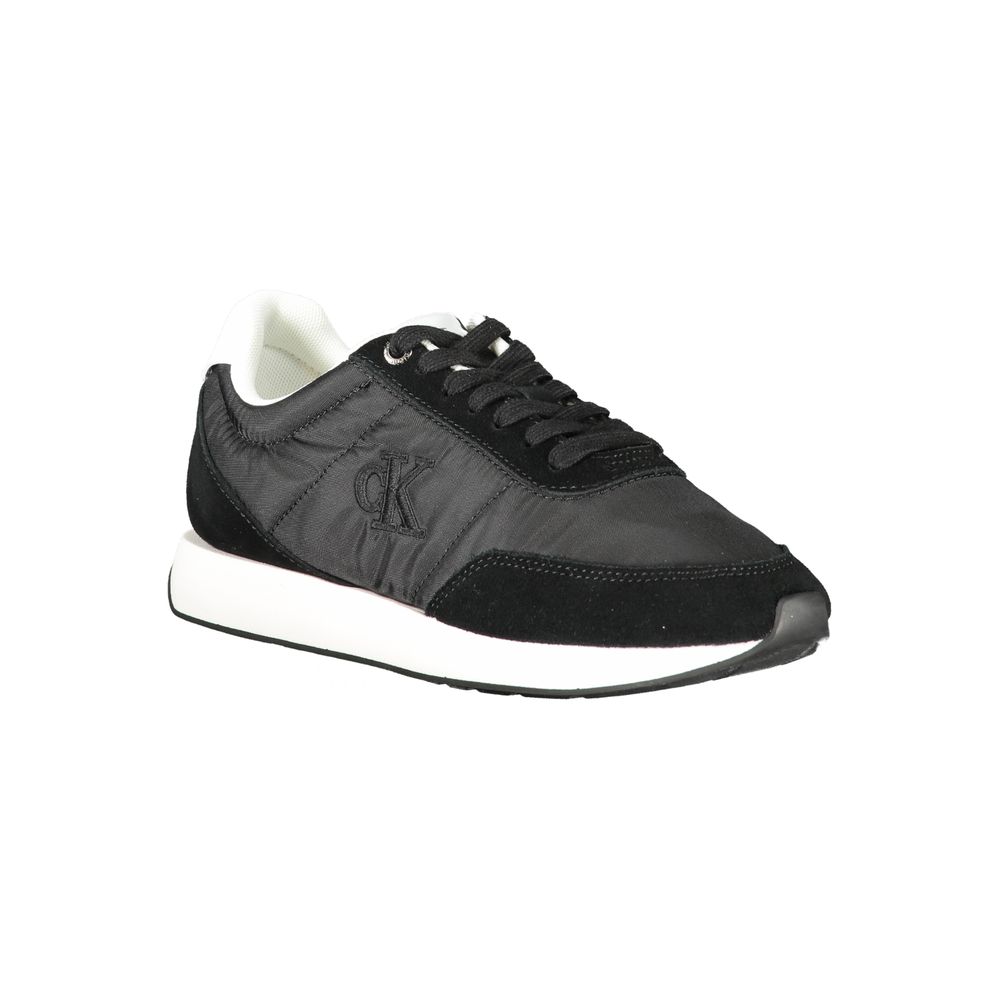 Black Leather Women SneakerStep into the urban jungle with unapologetic style in these Calvin Klein sneakers. Boasting a sleek black aesthetic punctuated by bold contrasting white details, these shoes are a sartorial staple for the fashion-forward. Design