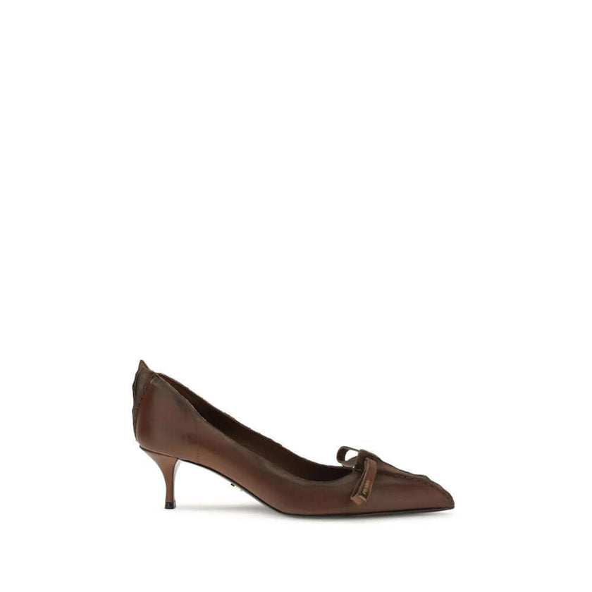 Antique leather PumpsAntique leather Pumps by Prada reinterpret a feminine classic with a bold, unconventional aesthetic. The tapered toe silhouette is crafted from leather with an antiqued effect, enhanced by exposed stitching and rough edges deliberatel