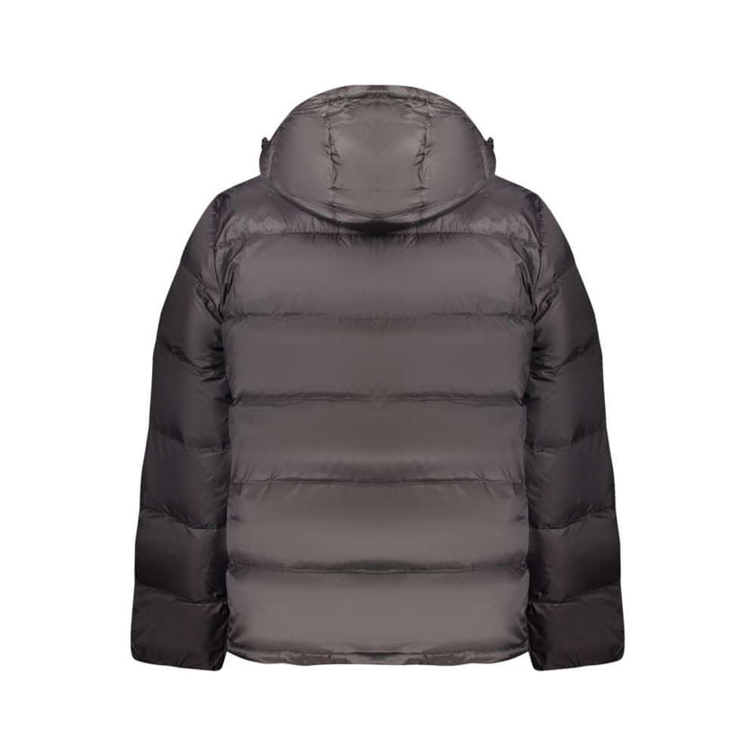 Black Polyamide Men JacketDiscover the epitome of urban sophistication with Calvin Klein’s sleek black jacket, tailor-made for the modern man. This long-sleeved marvel not only boasts a removable hood for versatility but is armed with two external and two