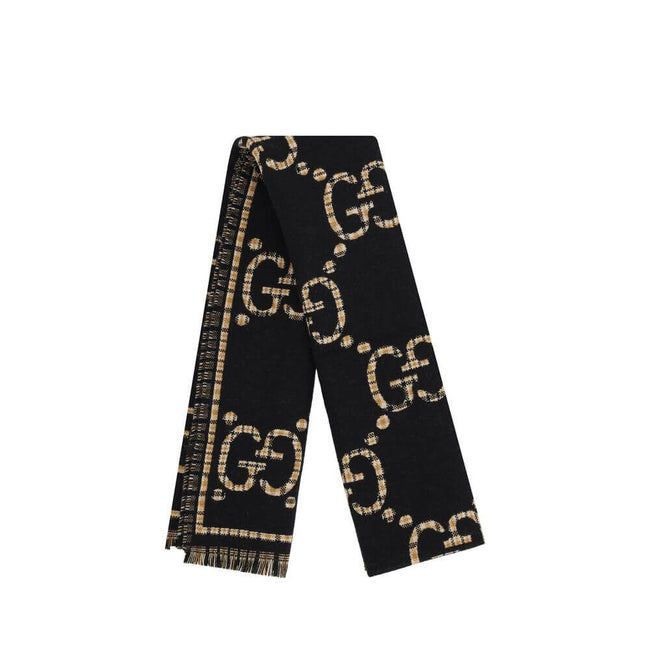 GG ScarfWool Scarf by Gucci features a GG houndstooth jacquard pattern repeated on the front and back, combining the iconic GG monogram with the sophisticated houndstooth motif. Frayed hems add a touch of casual and elegant detail. The scarf measures 47 x