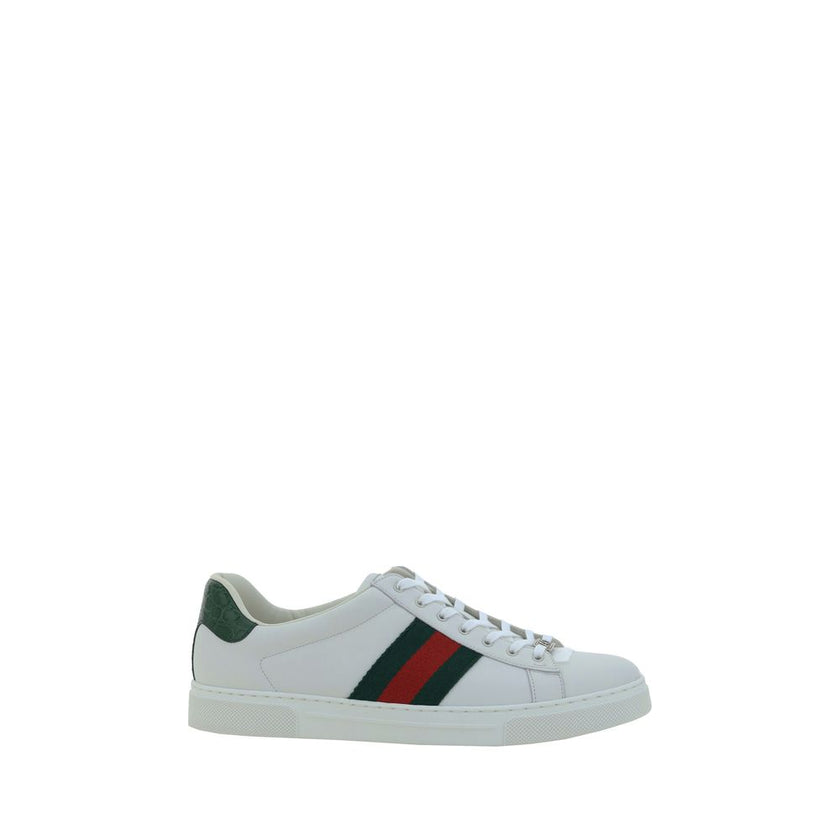 White Calf Leather Bos Taurus Low Top SneakersLeather Sneakers by Gucci feature a front closure via laces for an adjustable and secure fit, with a round toe for comfort. The flat sole offers stability and a modern look. A contrasting logo detail on the ba