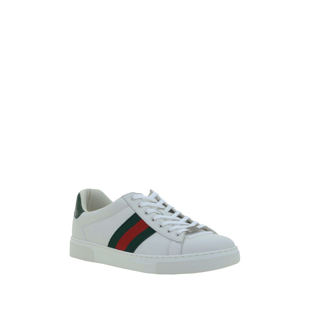 White Calf Leather Bos Taurus Low Top SneakersLeather Sneakers by Gucci feature a front closure via laces for an adjustable and secure fit, with a round toe for comfort. The flat sole offers stability and a modern look. A contrasting logo detail on the ba