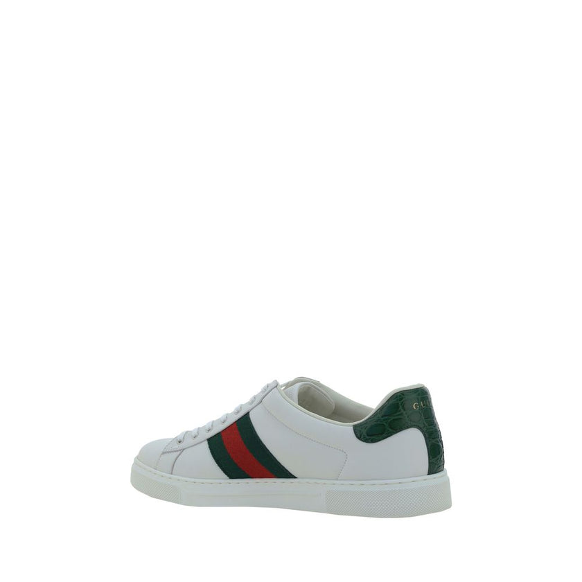 White Calf Leather Bos Taurus Low Top SneakersLeather Sneakers by Gucci feature a front closure via laces for an adjustable and secure fit, with a round toe for comfort. The flat sole offers stability and a modern look. A contrasting logo detail on the ba