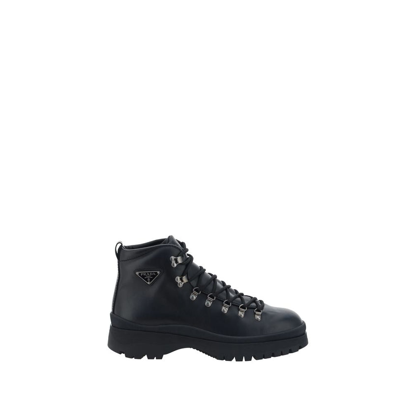 Black Rubber Lace-Up BootsLeather Ankle Boots by Prada reinterpret a wardrobe classic with a bold, contemporary attitude. Featuring a front lace-up closure and a handy pull-on at the back for easy donning, they feature a slip-resistant rubber lug sole tha