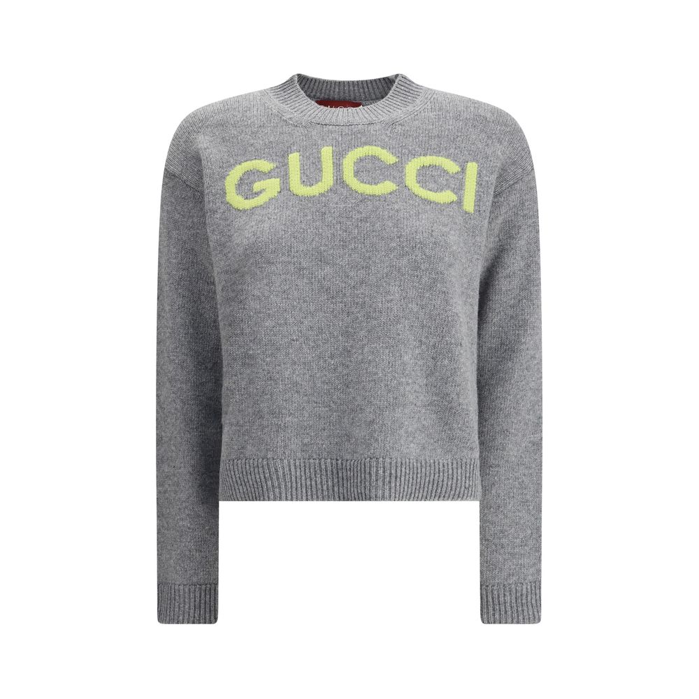 Gray Wool SweatshirtThe Wool Sweater by Gucci embodies the house’s knitwear tradition with a refined, understated design. Ribbed details at the crew neck, cuffs, and hem highlight its classic construction, while the contrasting embroidered monogram at the