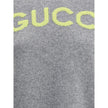 Gray Wool SweatshirtThe Wool Sweater by Gucci embodies the house’s knitwear tradition with a refined, understated design. Ribbed details at the crew neck, cuffs, and hem highlight its classic construction, while the contrasting embroidered monogram at the