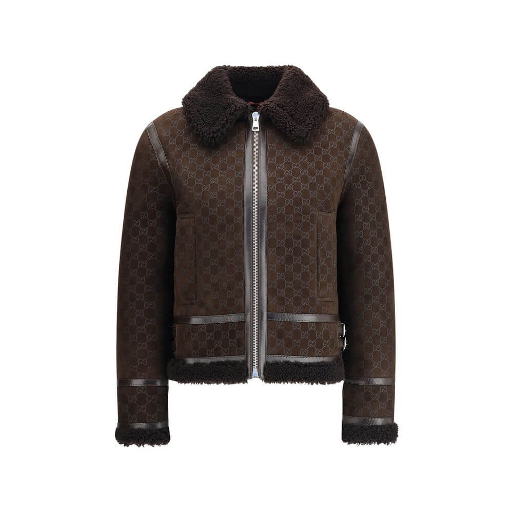 Brown Leather JacketThe Gucci Leather Jacket reimagines women’s outerwear with refined sophistication. Crafted from lambskin embossed with the GG motif, it reflects the maison’s distinctive codes. A shearling collar and lining enhance its warmth and envel