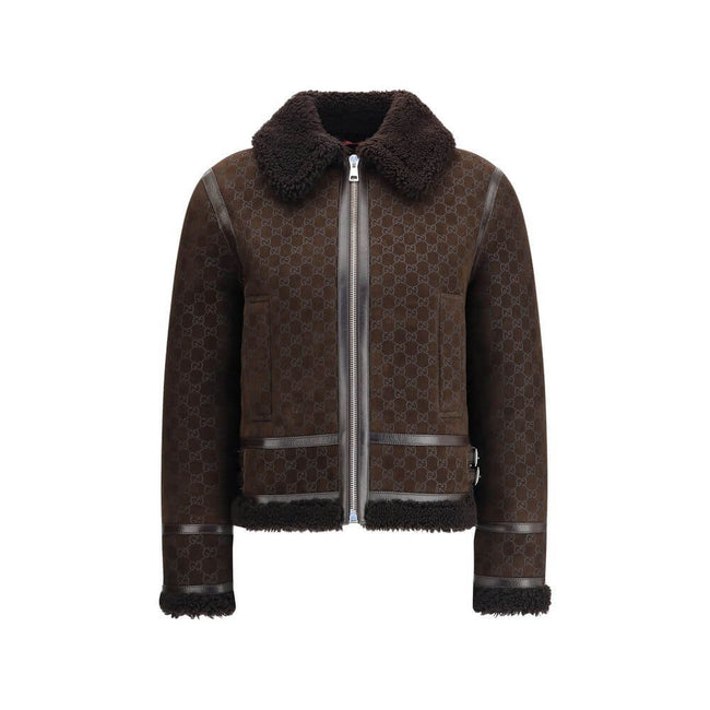Brown Leather JacketThe Gucci Leather Jacket reimagines women’s outerwear with refined sophistication. Crafted from lambskin embossed with the GG motif, it reflects the maison’s distinctive codes. A shearling collar and lining enhance its warmth and envel