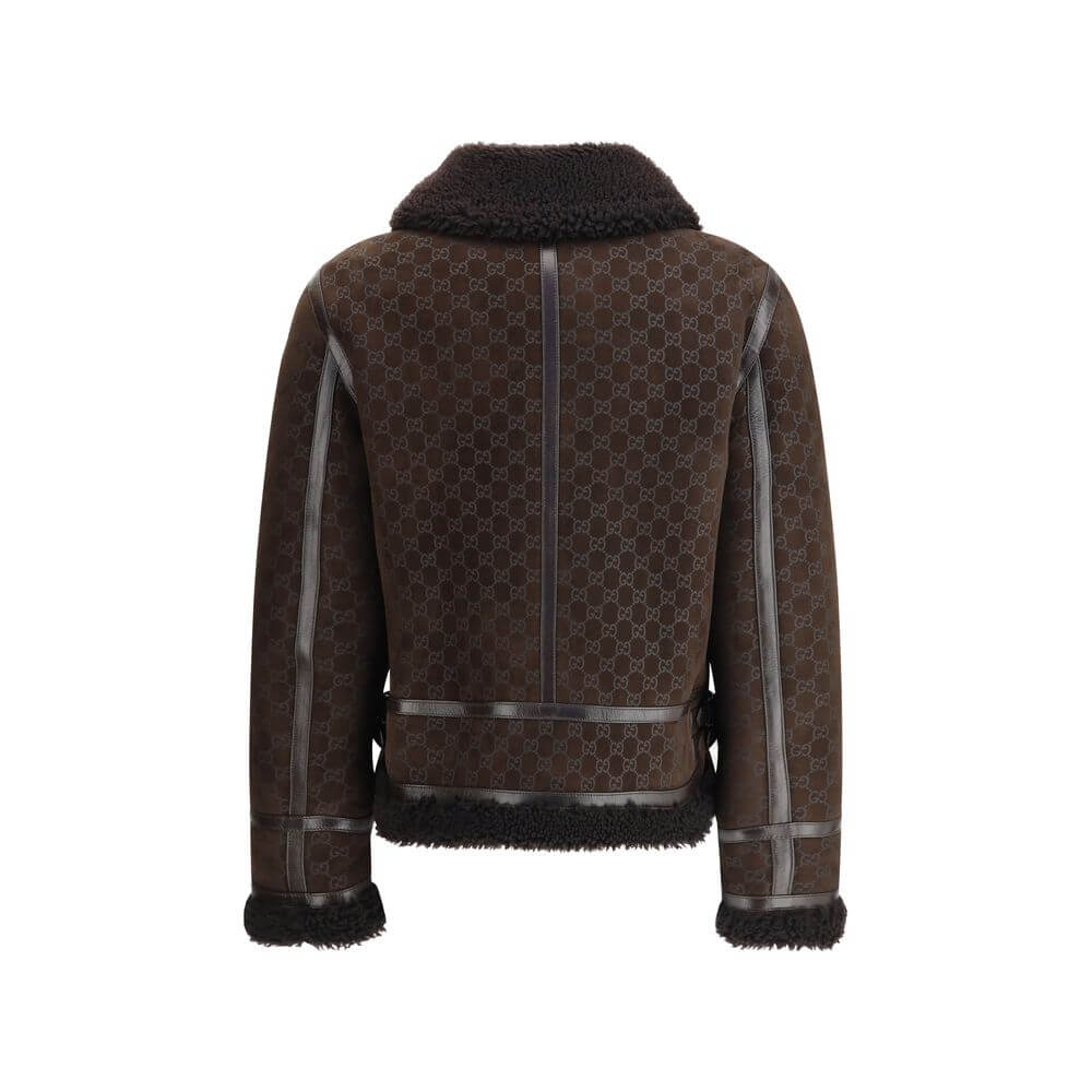 Brown Leather JacketThe Gucci Leather Jacket reimagines women’s outerwear with refined sophistication. Crafted from lambskin embossed with the GG motif, it reflects the maison’s distinctive codes. A shearling collar and lining enhance its warmth and envel