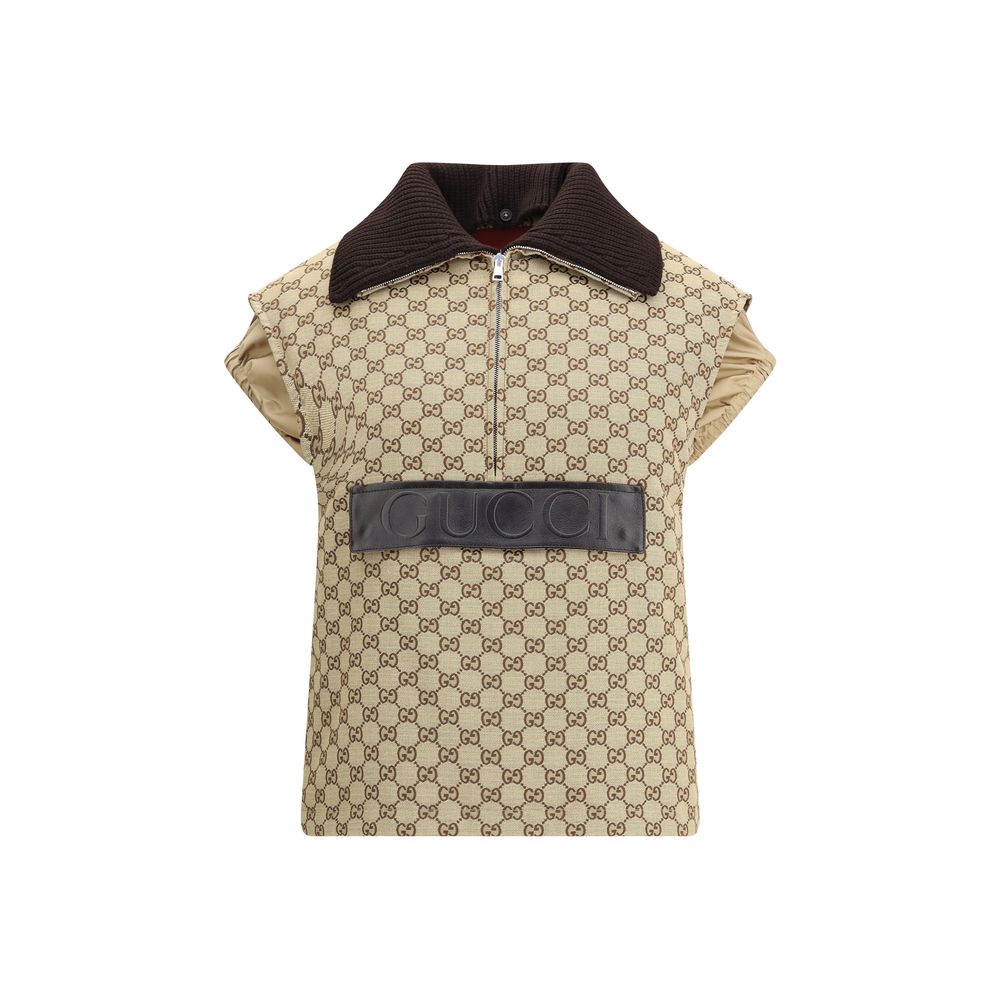 Beige Cotton Jackets And CoatThe Gucci bomber Gilet combines functionality with contemporary character in an essential piece. Sleeveless in design, it features a half zip closure and a single front pocket accented with a leather Gucci logo. Adjustable dra