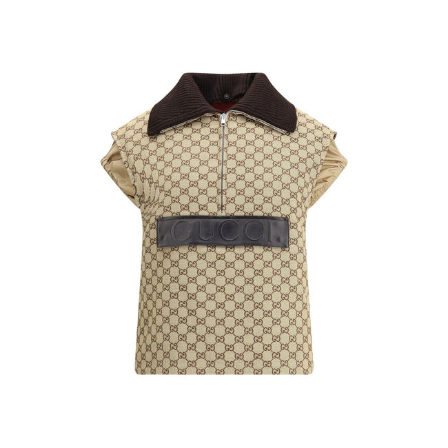 Beige Cotton Jackets And CoatThe Gucci bomber Gilet combines functionality with contemporary character in an essential piece. Sleeveless in design, it features a half zip closure and a single front pocket accented with a leather Gucci logo. Adjustable dra