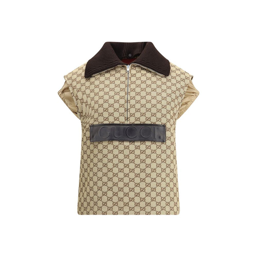 Beige Cotton Jackets And CoatThe Gucci bomber Gilet combines functionality with contemporary character in an essential piece. Sleeveless in design, it features a half zip closure and a single front pocket accented with a leather Gucci logo. Adjustable dra