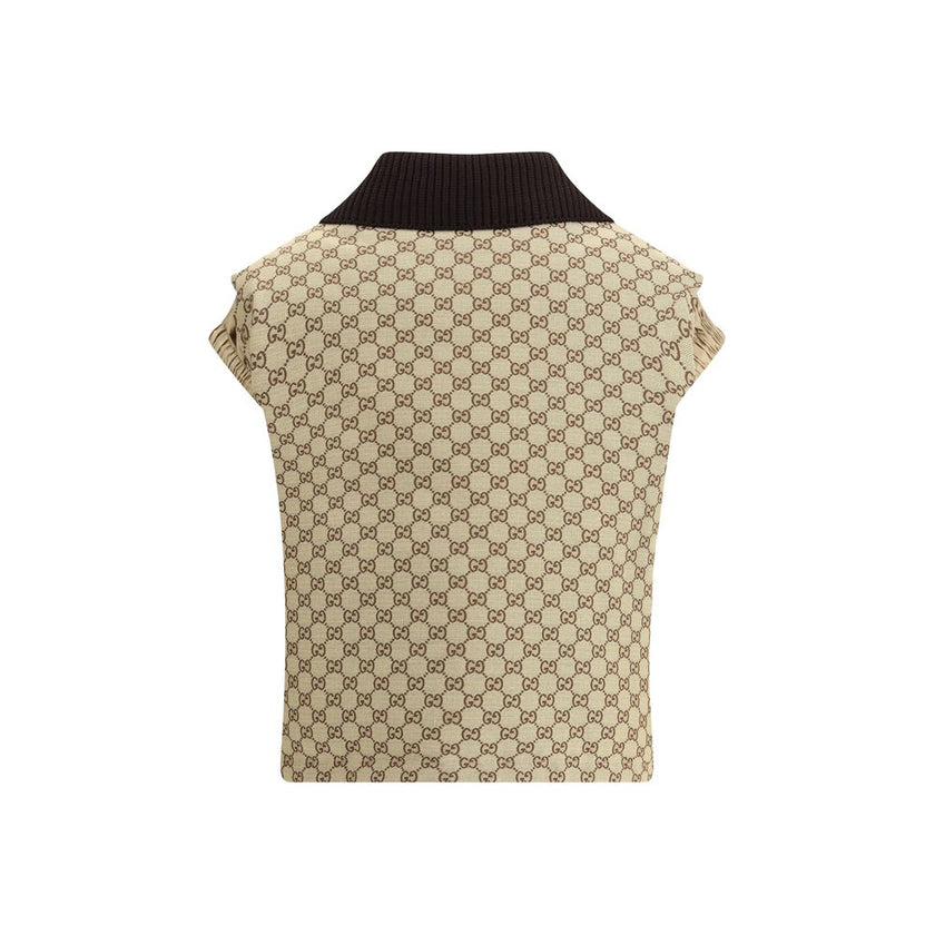 Beige Cotton Jackets And CoatThe Gucci bomber Gilet combines functionality with contemporary character in an essential piece. Sleeveless in design, it features a half zip closure and a single front pocket accented with a leather Gucci logo. Adjustable dra