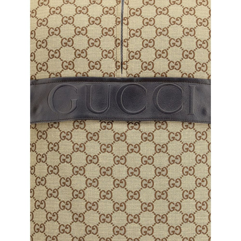 Beige Cotton Jackets And CoatThe Gucci bomber Gilet combines functionality with contemporary character in an essential piece. Sleeveless in design, it features a half zip closure and a single front pocket accented with a leather Gucci logo. Adjustable dra