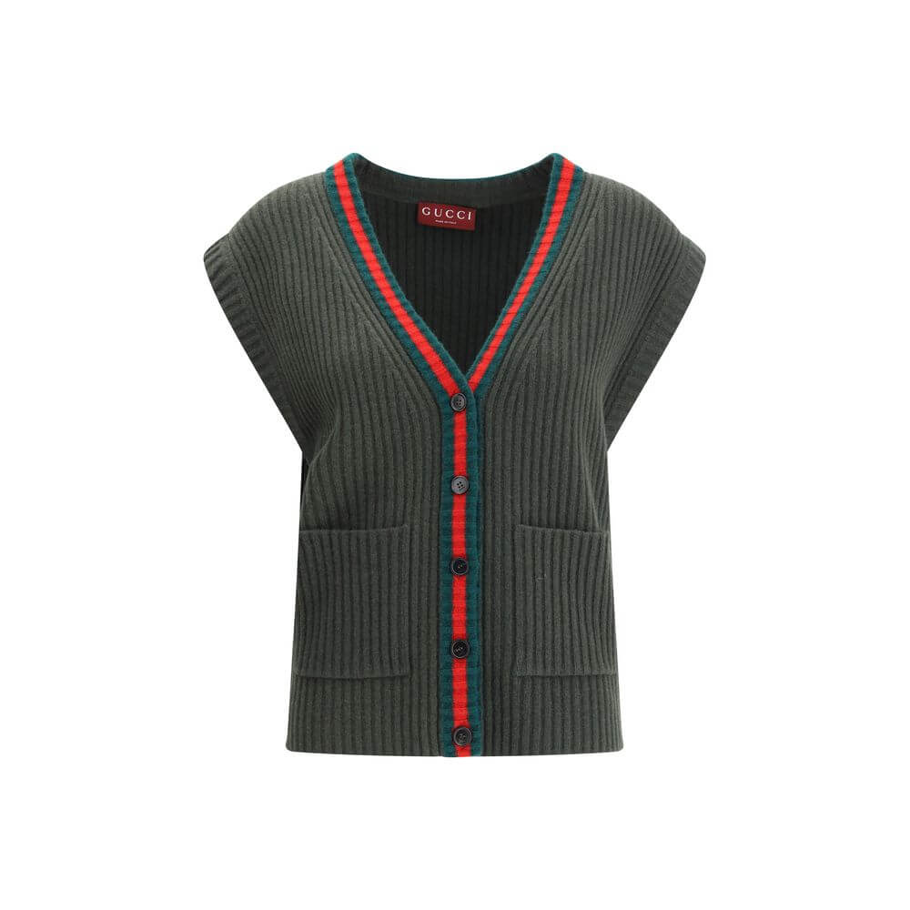 Green Wool Sleeveles SweaterThe Wool Cardigan Vest by Gucci revisits a knitwear essential with refined, contemporary appeal. Its V-neckline and ribbed construction highlight the quality of the yarn, while the contrasting trims add a sharp, graphic accent.