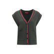 Green Wool Sleeveles SweaterThe Wool Cardigan Vest by Gucci revisits a knitwear essential with refined, contemporary appeal. Its V-neckline and ribbed construction highlight the quality of the yarn, while the contrasting trims add a sharp, graphic accent.