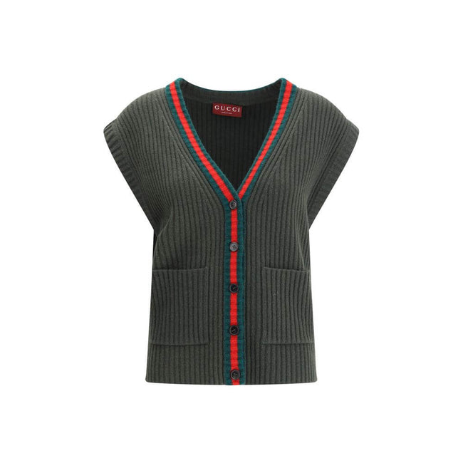 Green Wool Sleeveles SweaterThe Wool Cardigan Vest by Gucci revisits a knitwear essential with refined, contemporary appeal. Its V-neckline and ribbed construction highlight the quality of the yarn, while the contrasting trims add a sharp, graphic accent.