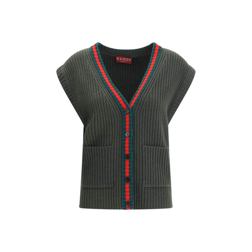 Green Wool Sleeveles SweaterThe Wool Cardigan Vest by Gucci revisits a knitwear essential with refined, contemporary appeal. Its V-neckline and ribbed construction highlight the quality of the yarn, while the contrasting trims add a sharp, graphic accent.