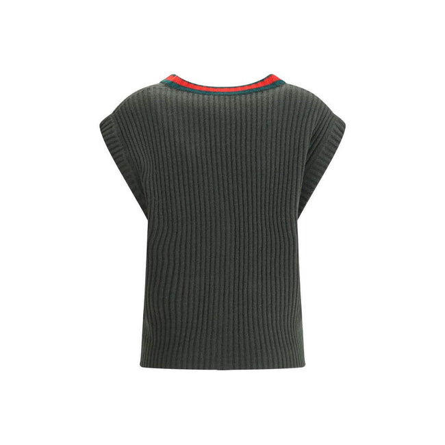 Green Wool Sleeveles SweaterThe Wool Cardigan Vest by Gucci revisits a knitwear essential with refined, contemporary appeal. Its V-neckline and ribbed construction highlight the quality of the yarn, while the contrasting trims add a sharp, graphic accent.