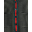Green Wool Sleeveles SweaterThe Wool Cardigan Vest by Gucci revisits a knitwear essential with refined, contemporary appeal. Its V-neckline and ribbed construction highlight the quality of the yarn, while the contrasting trims add a sharp, graphic accent.