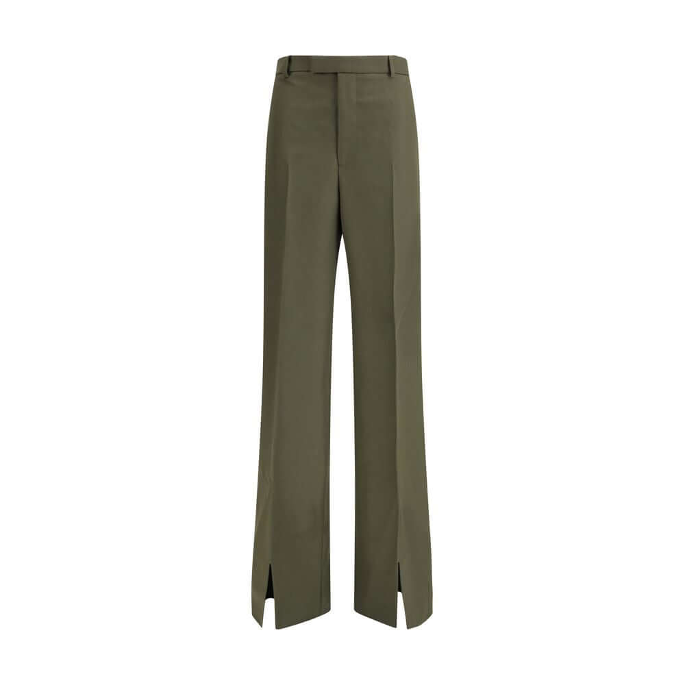 Green Wool PantsThe boyfriend Pants by Gucci, crafted from a refined wool and mohair blend, reinterpret masculine tailoring with effortless sophistication. A relaxed cut and split hem lend the piece a modern character, designed for a femininity that moves
