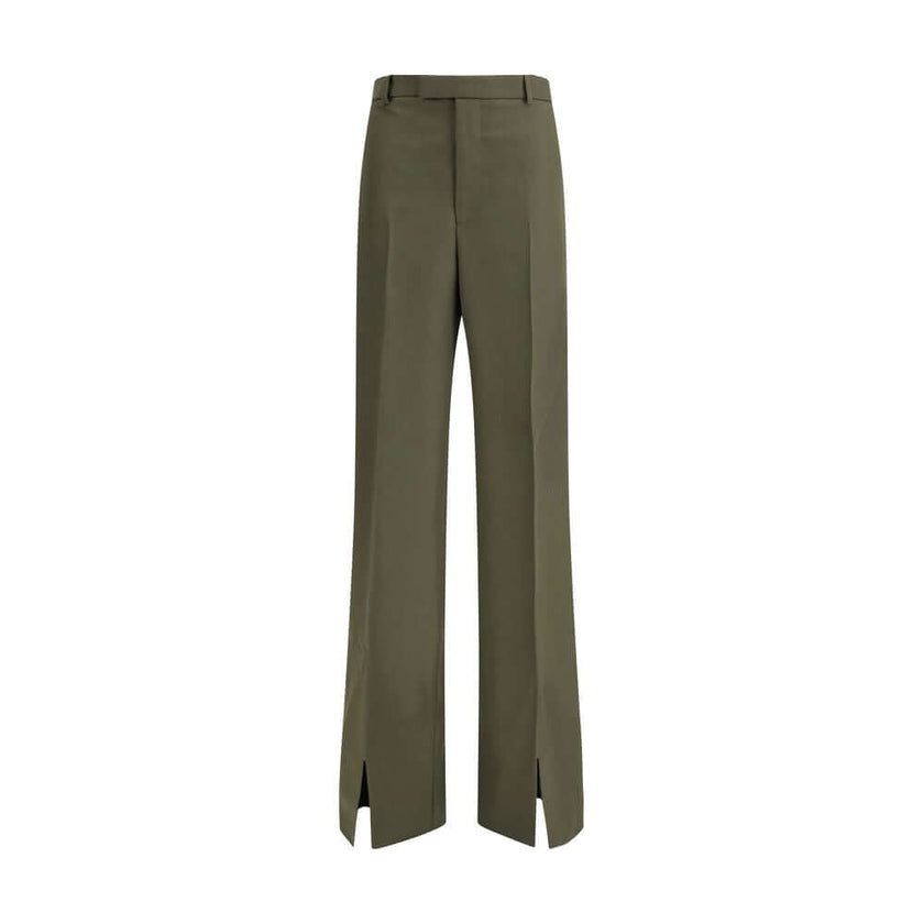 Green Wool PantsThe boyfriend Pants by Gucci, crafted from a refined wool and mohair blend, reinterpret masculine tailoring with effortless sophistication. A relaxed cut and split hem lend the piece a modern character, designed for a femininity that moves