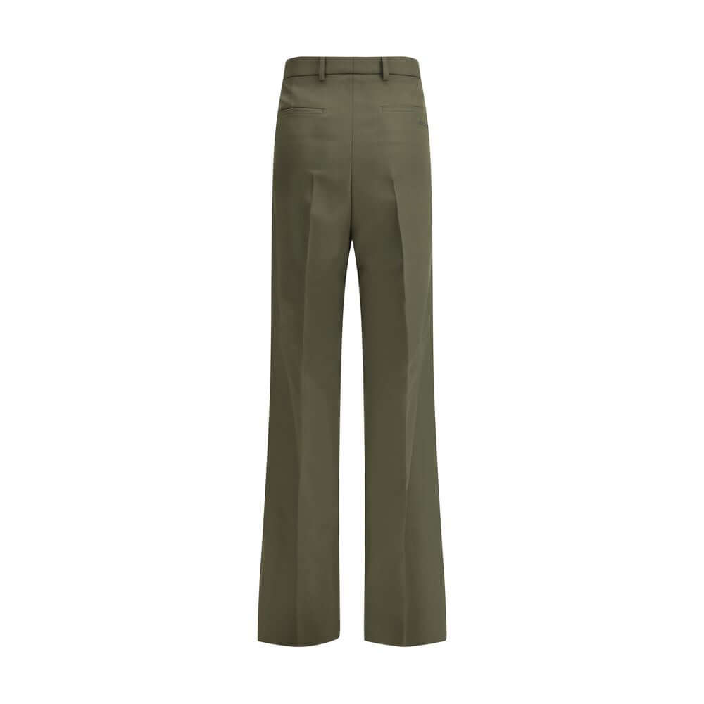 Green Wool PantsThe boyfriend Pants by Gucci, crafted from a refined wool and mohair blend, reinterpret masculine tailoring with effortless sophistication. A relaxed cut and split hem lend the piece a modern character, designed for a femininity that moves