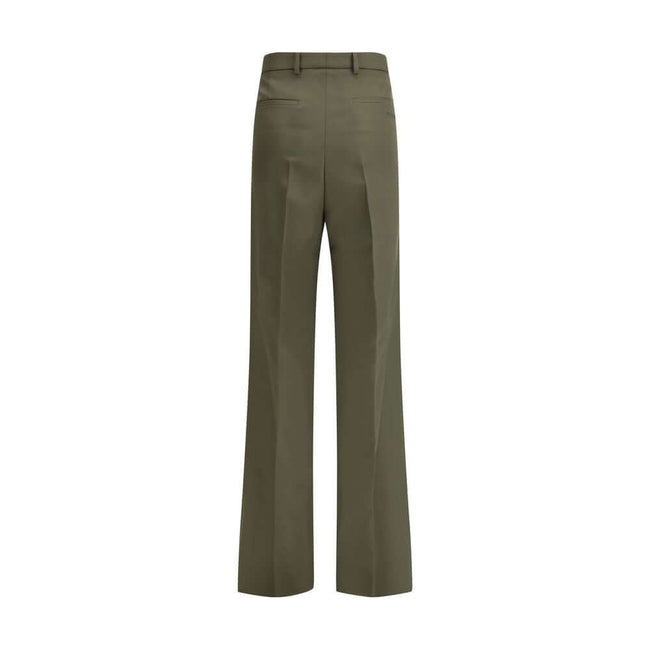 Green Wool PantsThe boyfriend Pants by Gucci, crafted from a refined wool and mohair blend, reinterpret masculine tailoring with effortless sophistication. A relaxed cut and split hem lend the piece a modern character, designed for a femininity that moves