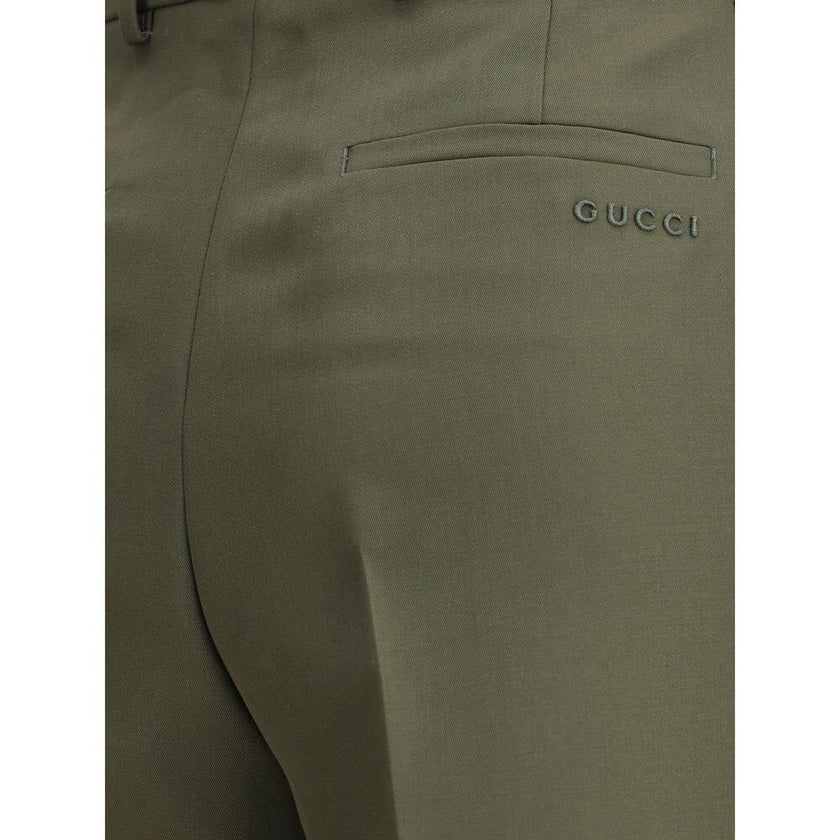Green Wool PantsThe boyfriend Pants by Gucci, crafted from a refined wool and mohair blend, reinterpret masculine tailoring with effortless sophistication. A relaxed cut and split hem lend the piece a modern character, designed for a femininity that moves