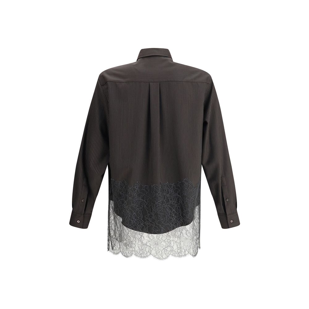 Brown Fleece Wool Pattern ShirtThe pinstripe Wool and Lace Shirt by Fendi blends sartorial rigor with delicate femininity. Designed with long sleeves and a button-down collar, it features exposed mother-of-pearl buttons that highlight its refined craftsma