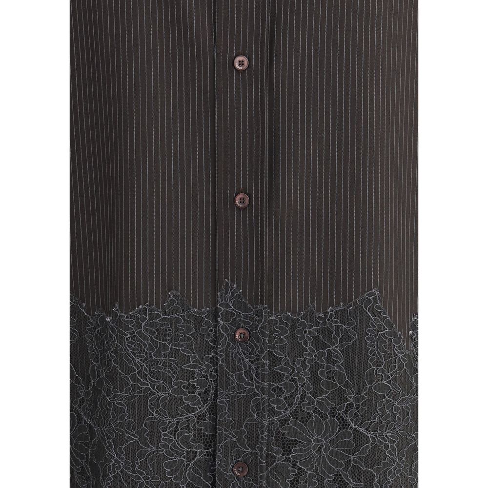 Brown Fleece Wool Pattern ShirtThe pinstripe Wool and Lace Shirt by Fendi blends sartorial rigor with delicate femininity. Designed with long sleeves and a button-down collar, it features exposed mother-of-pearl buttons that highlight its refined craftsma
