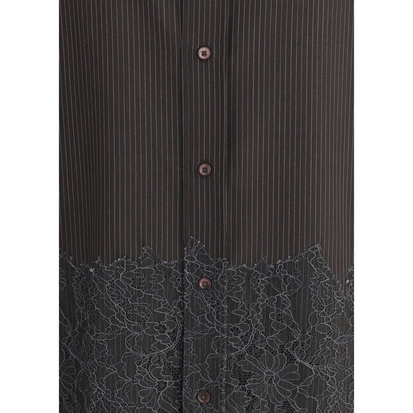 Brown Fleece Wool Pattern ShirtThe pinstripe Wool and Lace Shirt by Fendi blends sartorial rigor with delicate femininity. Designed with long sleeves and a button-down collar, it features exposed mother-of-pearl buttons that highlight its refined craftsma