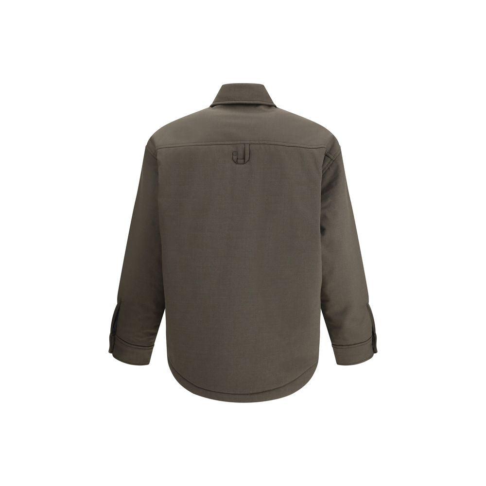 Bicolor Fleece Wool Jackets And CoatThe Boulanger Shirt by Jacquemus blends the elegance of a tailored shirt with the functionality of a padded jacket. Crafted from stretch virgin wool, it features a boxy fit with rounded shoulders, creating a bold, moder