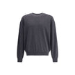 Gray Merino Wool SweatshirtThe crew-neck Sweater by Jacquemus, crafted from off-white merino wool, reflects effortless elegance. Overlock stitching beneath the neckline introduces a contemporary touch, while ribbed edges subtly define the relaxed silhouet