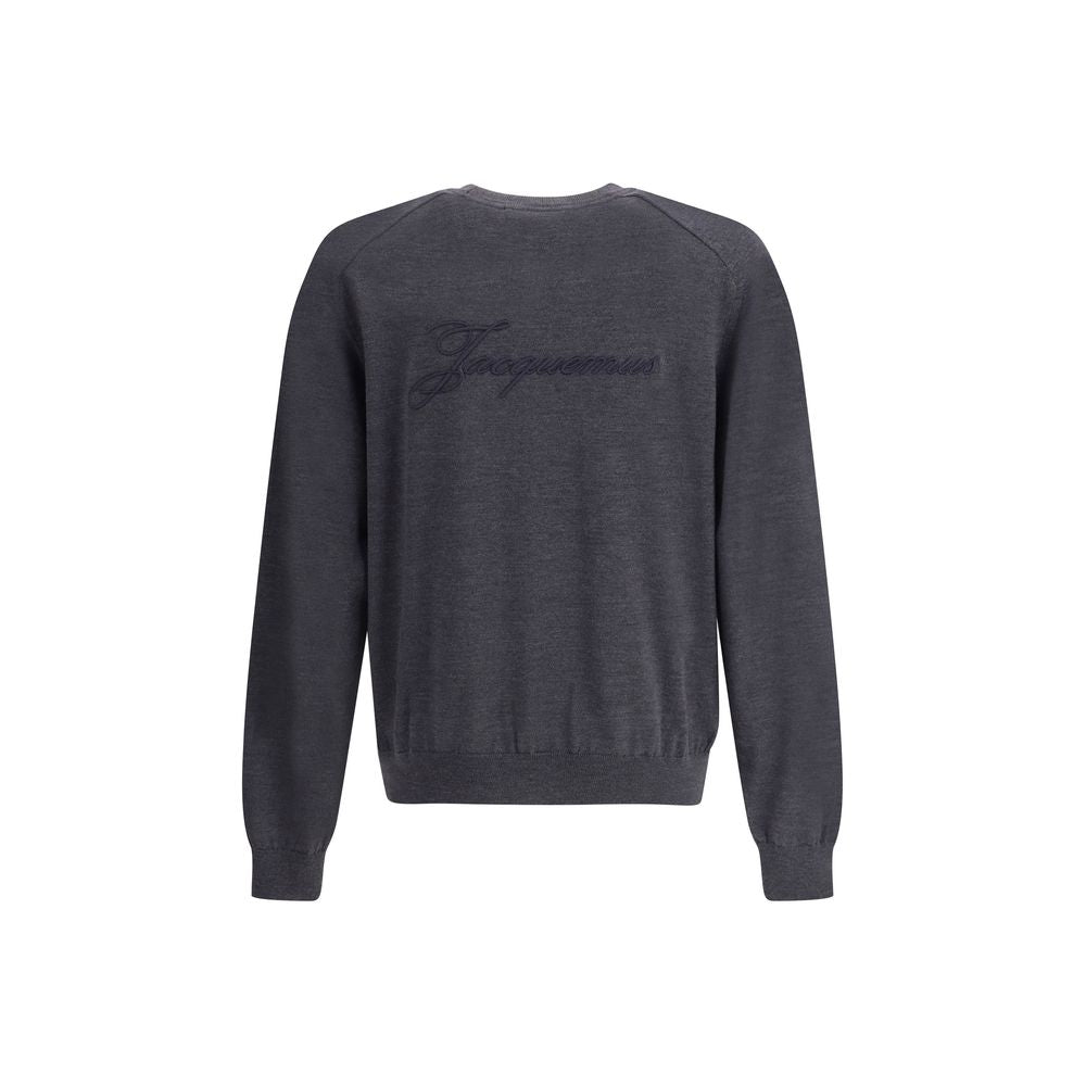 Gray Merino Wool SweatshirtThe crew-neck Sweater by Jacquemus, crafted from off-white merino wool, reflects effortless elegance. Overlock stitching beneath the neckline introduces a contemporary touch, while ribbed edges subtly define the relaxed silhouet