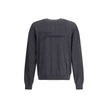 Gray Merino Wool SweatshirtThe crew-neck Sweater by Jacquemus, crafted from off-white merino wool, reflects effortless elegance. Overlock stitching beneath the neckline introduces a contemporary touch, while ribbed edges subtly define the relaxed silhouet