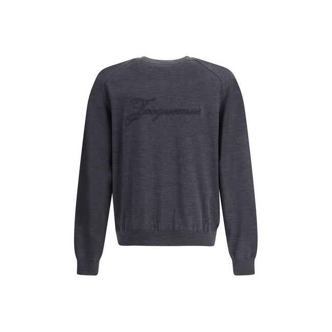 Gray Merino Wool SweatshirtThe crew-neck Sweater by Jacquemus, crafted from off-white merino wool, reflects effortless elegance. Overlock stitching beneath the neckline introduces a contemporary touch, while ribbed edges subtly define the relaxed silhouet