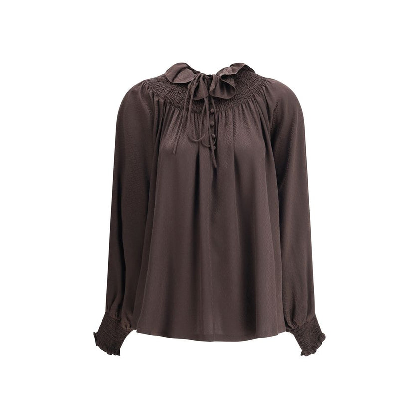 Brown Silk BlouseThe Geometric Silk Blouse by Burberry is crafted in Italy from silk crêpe de chine, jacquard-woven with a geometric pattern inspired by wallpapers found in British stately homes. Designed for a relaxed fit, it features smocking and delica