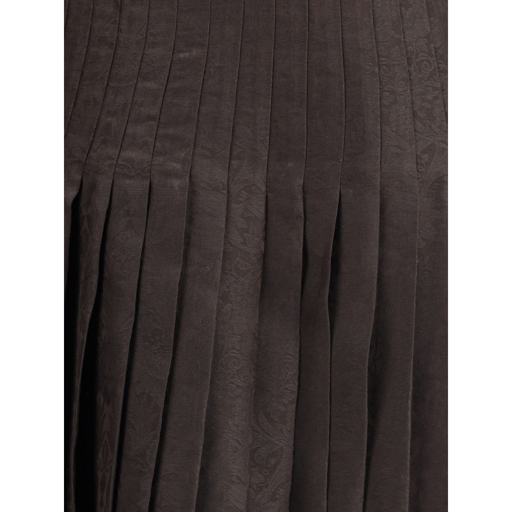 Brown Silk Midi SkirtThe Sunflower Pleated Silk Skirt by Burberry is a wrap piece that seamlessly blends heritage and modernity. Crafted from silk jacquard, it showcases William Morris’ Sunflower artwork from 1879, held at the Victoria and Albert Museum i