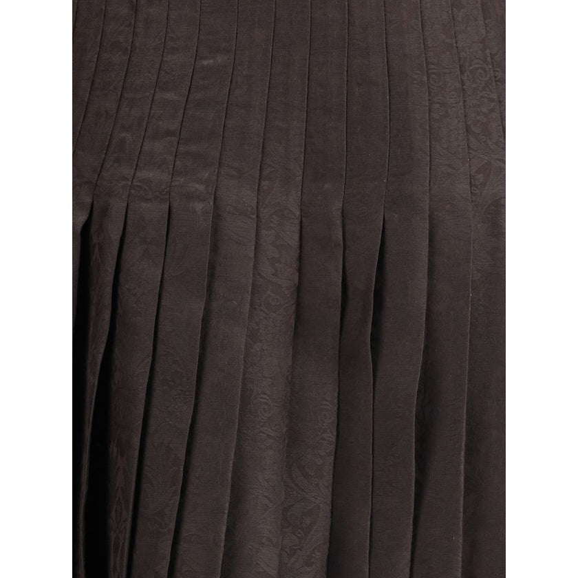 Brown Silk Midi SkirtThe Sunflower Pleated Silk Skirt by Burberry is a wrap piece that seamlessly blends heritage and modernity. Crafted from silk jacquard, it showcases William Morris’ Sunflower artwork from 1879, held at the Victoria and Albert Museum i