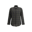 Green Cotton Pattern ShirtThe checked Shirt by Saint Laurent blends timeless tailoring with a modern edge. Crafted in soft cotton, it features a pointed collar and a chest patch pocket embroidered with the iconic Cassandre logo. A front button closure, si