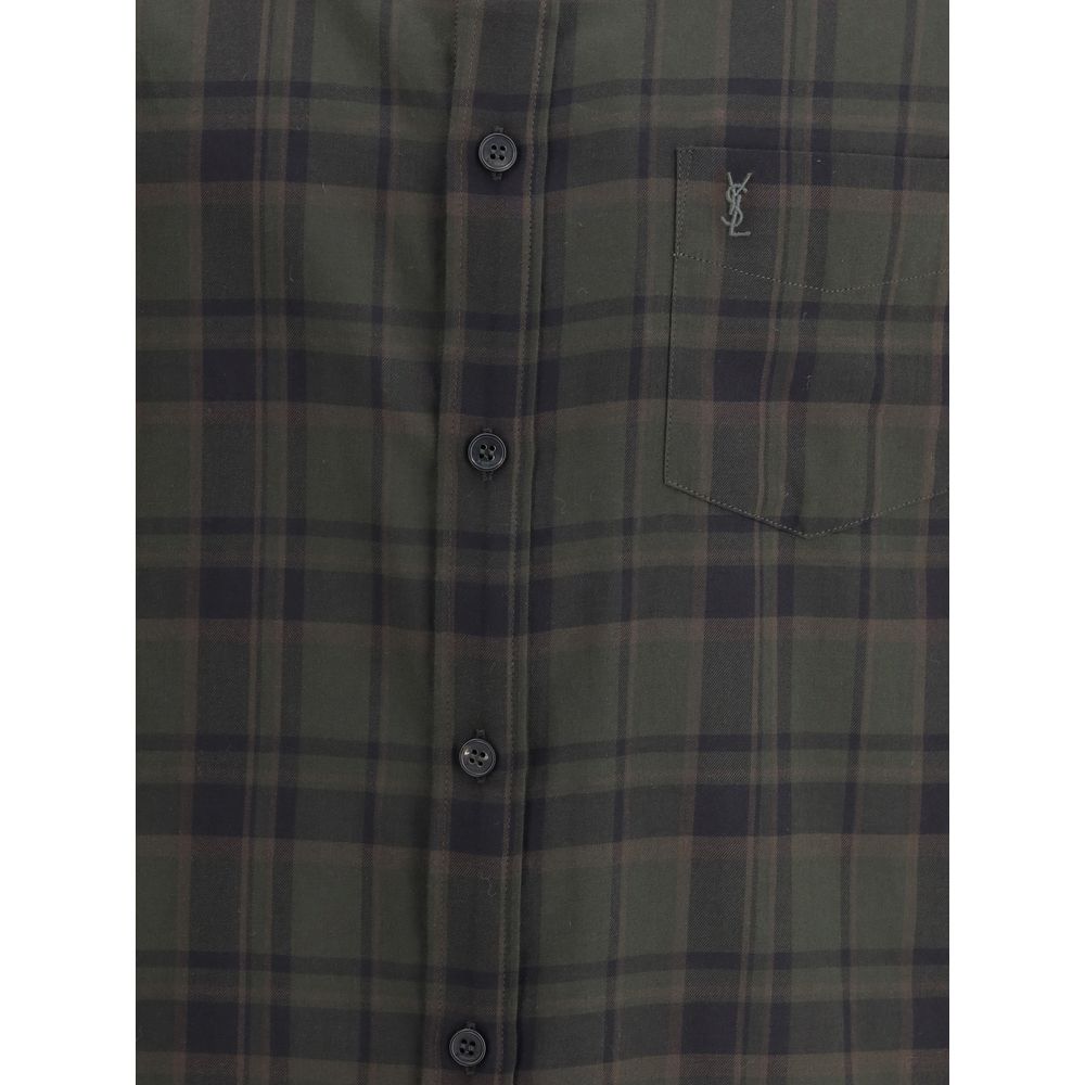 Green Cotton Pattern ShirtThe checked Shirt by Saint Laurent blends timeless tailoring with a modern edge. Crafted in soft cotton, it features a pointed collar and a chest patch pocket embroidered with the iconic Cassandre logo. A front button closure, si