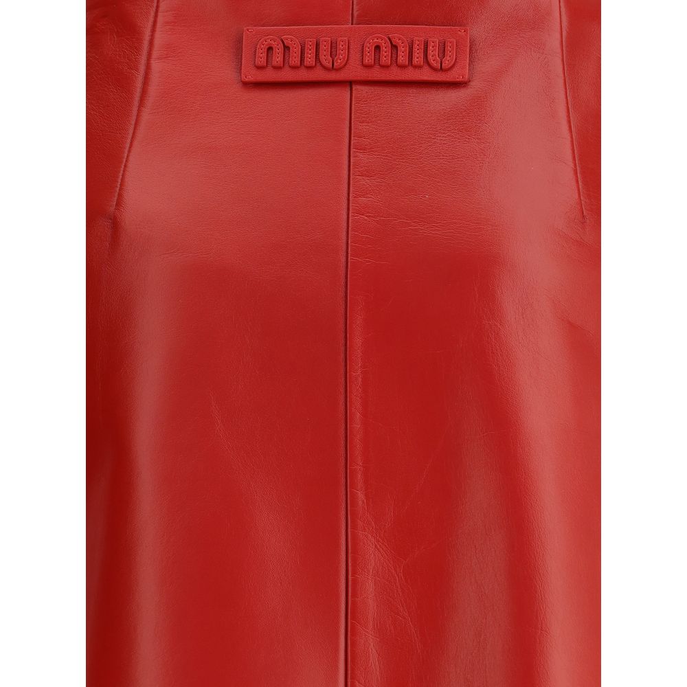 Red Lamb Leather Mini SkirtThe Nappa Leather Skirt by Miu Miu embodies sophisticated femininity with its sleek lines and lively shades. Crafted from supple nappa leather, it is enhanced by the natural sheen and softness achieved through meticulous hand-fi