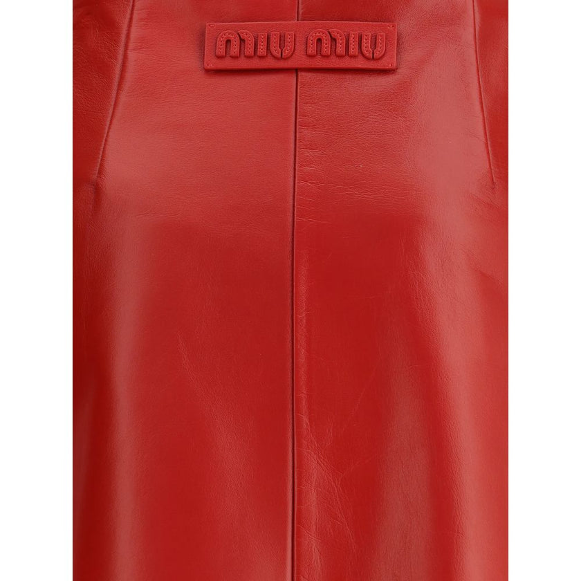 Red Lamb Leather Mini SkirtThe Nappa Leather Skirt by Miu Miu embodies sophisticated femininity with its sleek lines and lively shades. Crafted from supple nappa leather, it is enhanced by the natural sheen and softness achieved through meticulous hand-fi