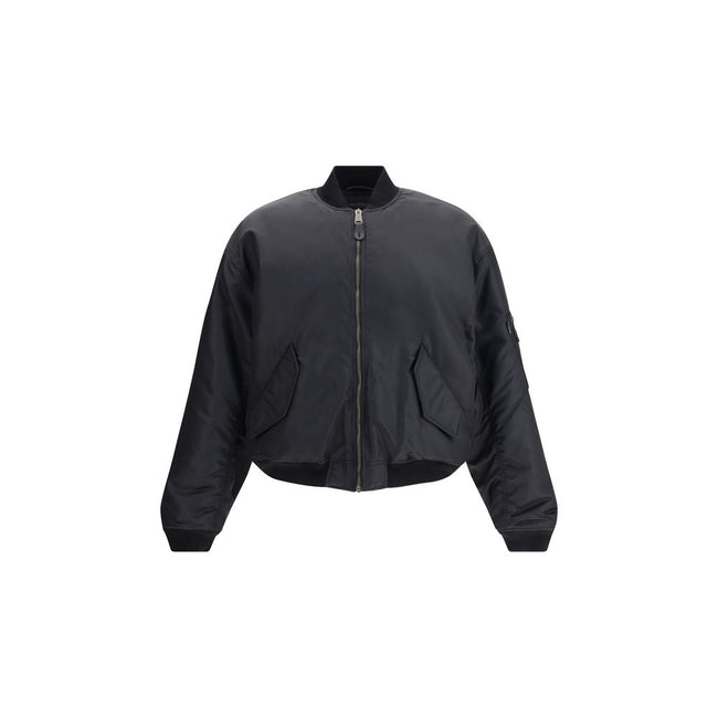 Zipped Standard BomberThe Bomber Standard by Balenciaga reimagines a streetwear classic with the brand’s bold aesthetic. Crafted from recycled satin polyamide, it features a zip closure, two flap pockets with snap buttons at the front, and the iconic zip