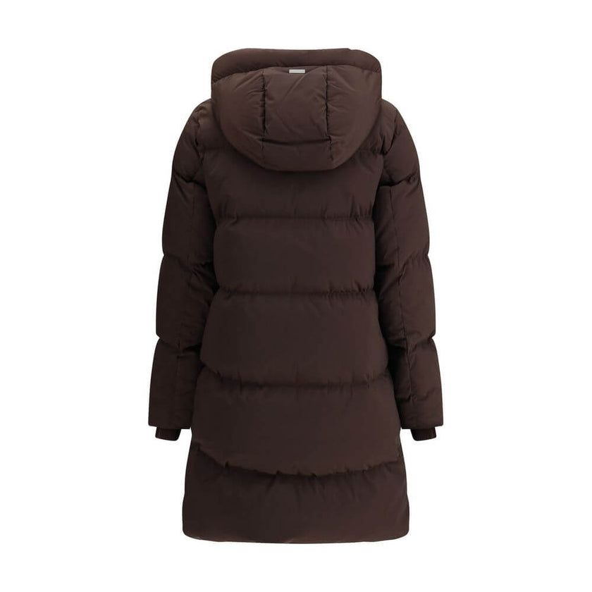 Brown Goose Down ParkaThe Kelly Down Jacket by Woolrich combines practicality and contemporary style. Featuring elastic cuffs and a hood, it features a front zipper and button closure, zippered side slits and two welt pockets. The padded and quilted desig