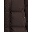 Brown Goose Down ParkaThe Kelly Down Jacket by Woolrich combines practicality and contemporary style. Featuring elastic cuffs and a hood, it features a front zipper and button closure, zippered side slits and two welt pockets. The padded and quilted desig